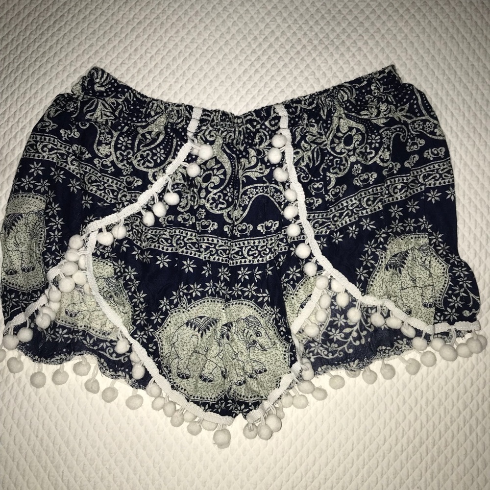 TWO pairs of flowy printed shorts